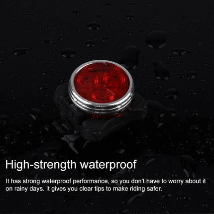 COB Bicycle Light USB Rechargeable Headlight and Taillight - waterproof red LED taillight on wet surface, compact aluminum bike safety light