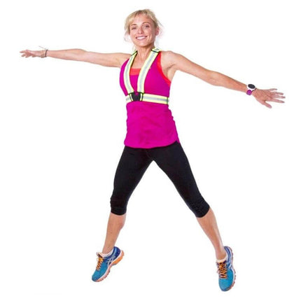 Reflective Neon Green Safety Vest for Night Running and Riding worn by woman jumping to show fit and reflective strips