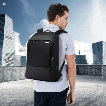 Bopai Waterproof Anti-Theft Large Capacity Shoulder Bag shown on a man commuting in city, black water-resistant anti-theft daily travel backpack