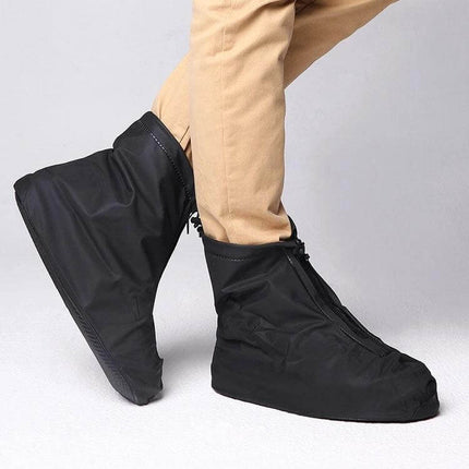 Alt Tag: Fashion XL Waterproof Thick-Soled Non-Slip PVC Shoe Cover in black on a commuter wearing khaki pants, waterproof protection for rainy days