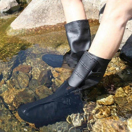 Adult XXL High Tube Shoe Cover for Rain and Snow Protection shown worn in shallow stream protecting shoes from water and slippery rocks