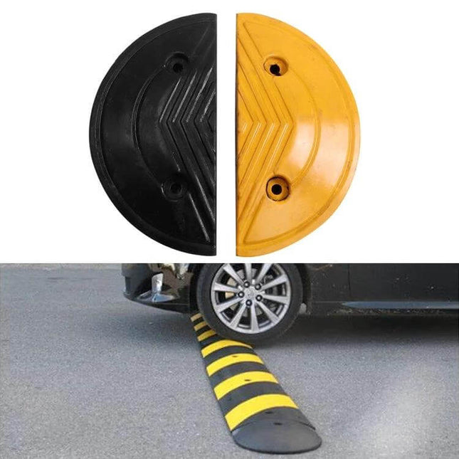 Pair of 40cm Diameter Round Heads for Rubber Speed Bumps - black and yellow half-round rubber heads installed on road to slow vehicles
