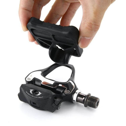SPD-SL Locking Pedal Adapters for Road Bikes Casual Rides - hand installing lightweight adapter converting clipless pedal to street shoe platform