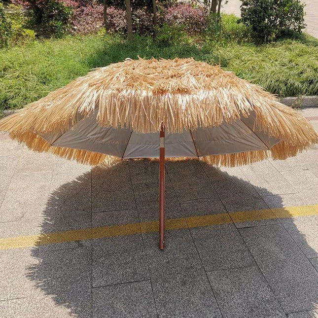 Large 2-Meter Imitation Straw Umbrella for Beach Shade on pavement showing fringe, wooden pole, and portable sun protection