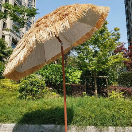 Large 2-Meter Imitation Straw Umbrella for Beach Shade set up in a sunny backyard providing portable sun protection