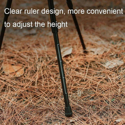 Outdoor Folding Round Camping Table, Aluminum Alloy, Black Wood Finish compact adjustable-height leg close-up on pine needle ground