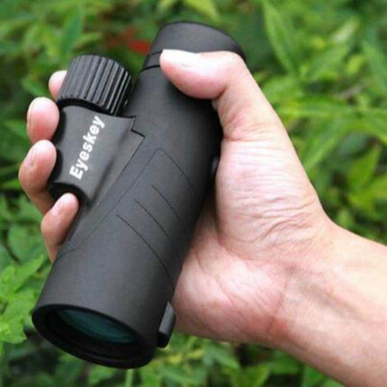Outdoor HD Portable Monocular For Wildlife Viewing held in hand, compact black monocular with Bak4 prism and FMC coatings for birding and hiking