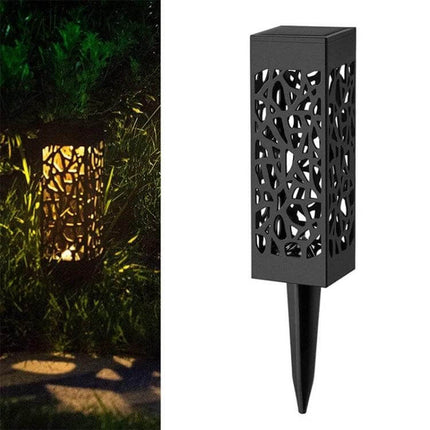 Outdoor Hollowing Out Solar Energy Garden Lawn Lamp For Pathways decorative hollow stake lamp casting warm patterned glow along garden path