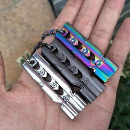 Outdoor Survival Whistle With Key Ring Stainless Steel — three compact stainless whistles on key rings in silver, gray and rainbow finish