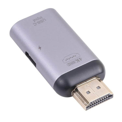 Versatile USB-C to HDMI Adapter for Screen Mirroring and Charging showing compact plug-and-play aluminum HDMI connector with USB-C charging port