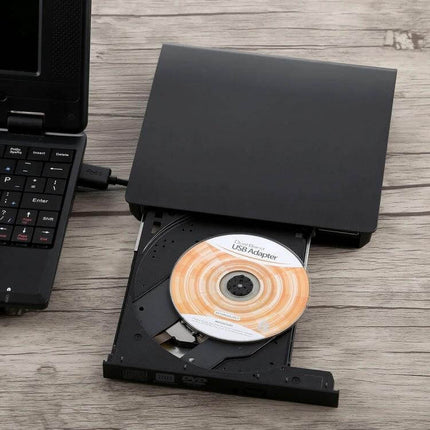 Portable USB 3.0 External DVD-RW Drive for Laptops and Desktops connected to laptop with disc tray open, showing CD being inserted
