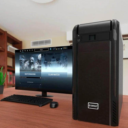 ORICO Enclosure for 3.5 Inch Internal Hard Drives in Optical Bays installed in desktop PC next to monitor showing gaming screen