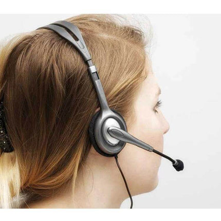 Logitech Wired Stereo Headset With Inline Mic For Calls shown on woman in profile using 3.5mm wired headset for calls and media