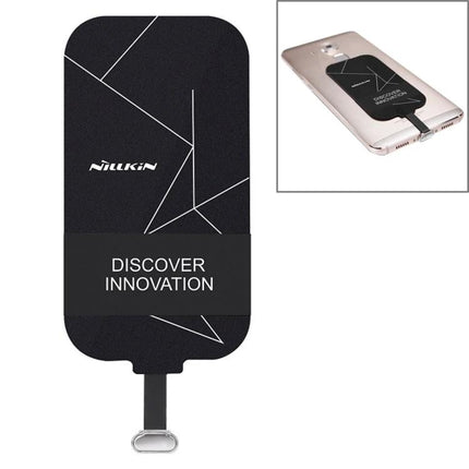 Compact NILLKIN Receiver for Daily Phone Charging attached to a Type-C phone for wireless, hands-free charging on a pad
