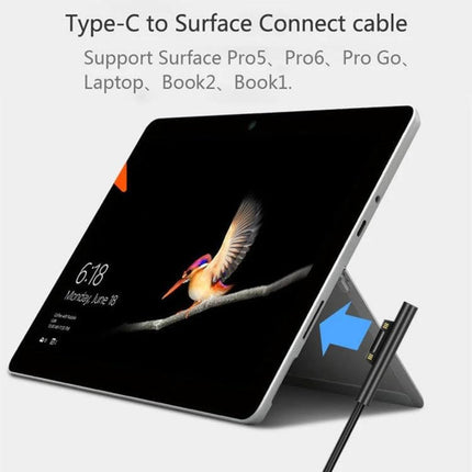 Magnetic USB-C to 6 Pin Charging Cable for Microsoft Surface Pro 7/6/5 shown connecting magnetically to Surface Pro on stand