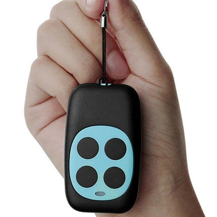 Wireless Four-Key Copying Remote for Garage Doors held in hand showing durable metal body and four-button layout