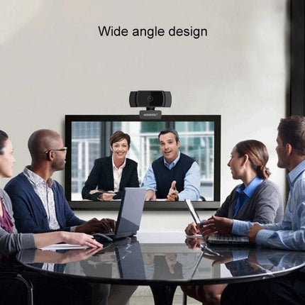 Aoni Webcam with Built-in Microphone for Video Calls and Streaming mounted above monitor during a business video conference, wide angle, HD 1920x1080