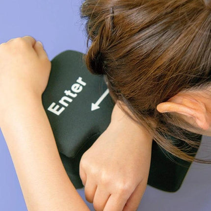 Big Enter Button USB Pillow for Relaxing at Your Desk - Black showing person resting head on soft Enter key shaped USB pillow