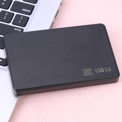 External Hard Drive Case for 2.5 Inch Storage Devices - black USB 3.0 enclosure beside laptop for fast portable data backup