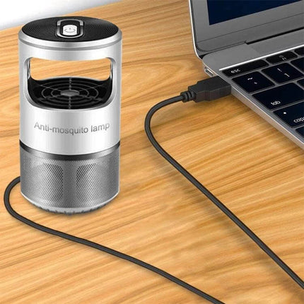 Multi-Function 12-in-1 USB Charging Cable for Various Devices in Black connected to laptop on wooden desk
