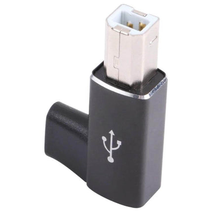 USB-C to USB 2.0 B MIDI Adapter for Electronic Instruments — compact angled adapter connecting USB-C devices to MIDI-equipped instruments for recording