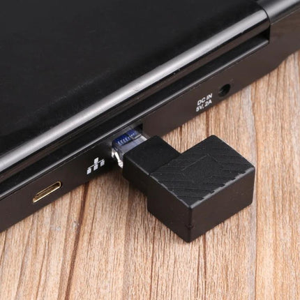 RJ45 90-Degree Extension Adapter for Ethernet Cables plugged into laptop to reduce port strain in tight spaces