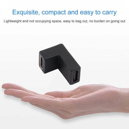 Aluminum USB-C to USB-C Adapter for Everyday Charging compact L-shaped black adapter shown over hand for travel and charging