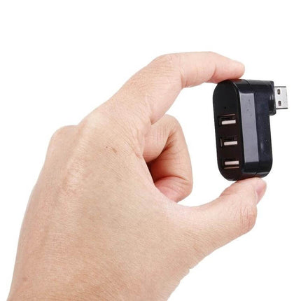 Portable USB Hub with 180-Degree Rotation for Device Connections small black 3-port hub held between fingers for compact portable use