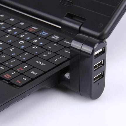 Portable USB Hub with 180-Degree Rotation for Device Connections attached to laptop USB port, three-port compact hub