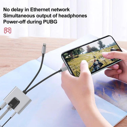 NK-1056Pro Adapter for Everyday Device Connectivity and Charging connected to phone for Ethernet, charging and headphones while gaming