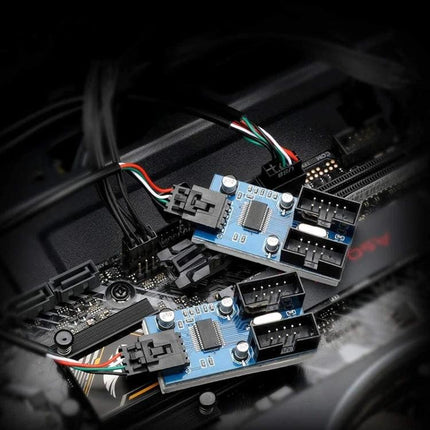 Rocketek USB Splitter Adapter for Multiple Connections connected to motherboard showing two blue USB2.0 splitter boards managing multiple device ports
