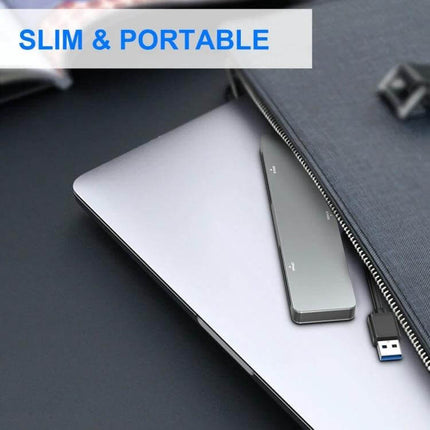 Rocketek Multi-Function Card Reader for SD and CF Cards slim portable USB card reader next to laptop and sleeve