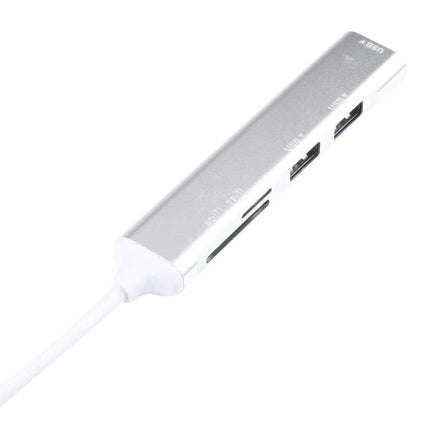USB-C Multi-Port Hub with SD Card Reader and USB Ports shown connected, silver compact hub with SD slot and dual USB ports for photographers and travelers