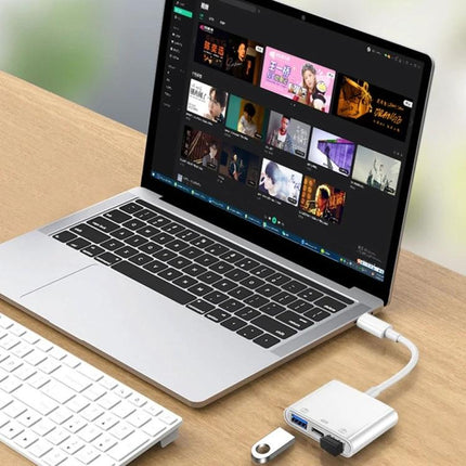 Handy Adapter for Everyday Smartphone Device Connections On the Go attached to laptop Type-C hub for charging, file transfer and USB accessories