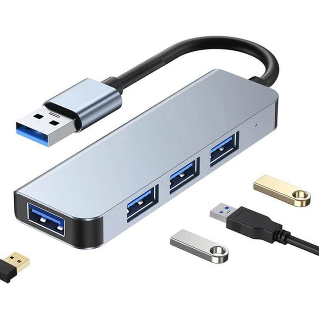 Four-Port USB Hub for Connecting Multiple Devices, slim aluminum USB 3.0 hub showing four ports with connected flash drives and peripherals