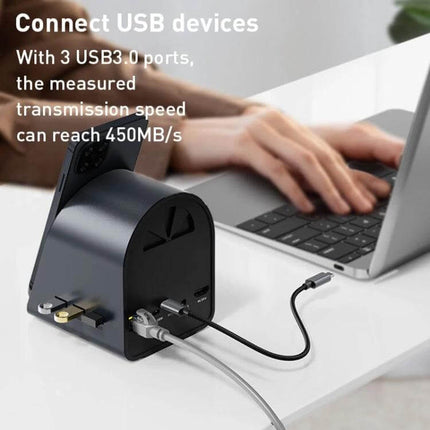 USB-C 10-in-1 Hub Adapter for Computer Connectivity and Charging plugged into laptop powering devices and connecting USB and Ethernet