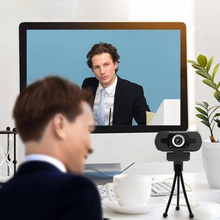 High-Definition Webcam with Built-in Microphone for Video Calls showing a professional video conference setup with tripod-mounted USB webcam and participant on screen