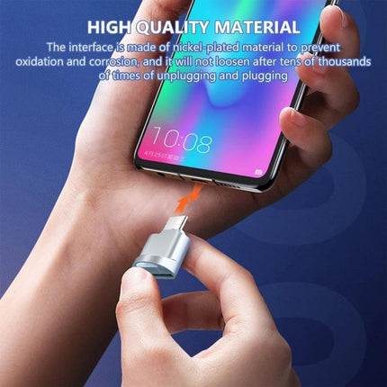USB-C Adapter for Everyday SD Card Transfers — compact nickel-plated adapter plugging into smartphone for quick SD file transfers on the go