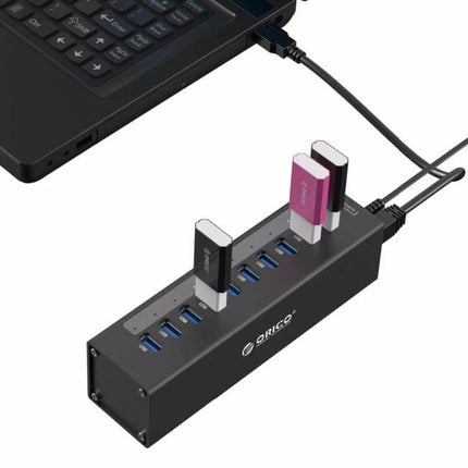 ORICO Aluminum 10-Port USB 3.0 Hub for Laptop Connections showing aluminum 10-port hub connected to laptop with multiple USB drives inserted