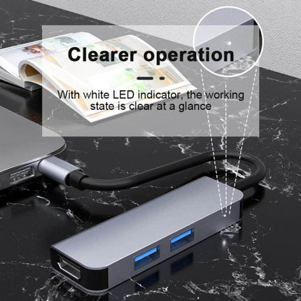 Compact USB-C Docking Station for Expanding Laptop Ports showing LED indicator and dual USB ports connected to a laptop