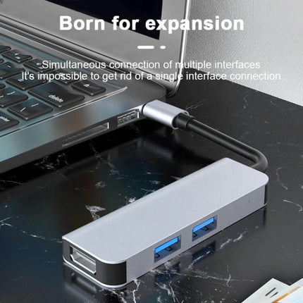 Compact USB-C Docking Station for Expanding Laptop Ports connected to a laptop showing multiple USB and display ports
