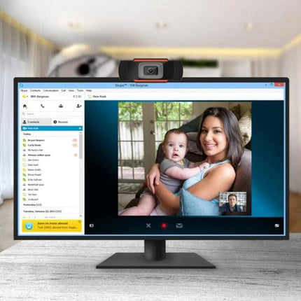 USB Webcam with Built-in Microphone for PC and Laptop Video Calls showing mother and baby on a Skype video call with adjustable-angle webcam