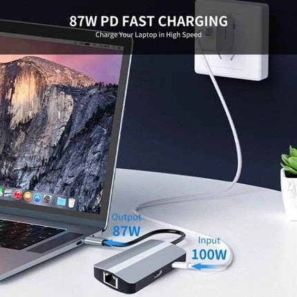 BYL 6-in-1 USB-C Multifunctional Docking Station for Connectivity connected to laptop showing 87W PD fast charging and 100W input