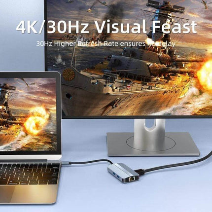 BYL 6-In-1 USB-C Docking Station for Multiple Ports connected to laptop and monitor showing 4K/30Hz gameplay, compact aluminum hub with HDMI and Ethernet