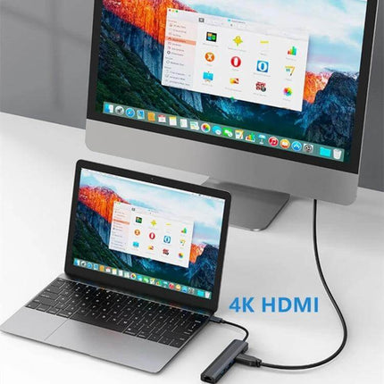 BYL USB-C Multi-Port Docking Station with Ethernet Adapter connected to laptop and monitor via 4K HDMI, showing peripherals and charging