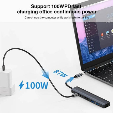 BYL 7-in-1 USB-C Docking Station for Device Connectivity Solutions showing 100W PD pass-through charging to laptop with multiple ports