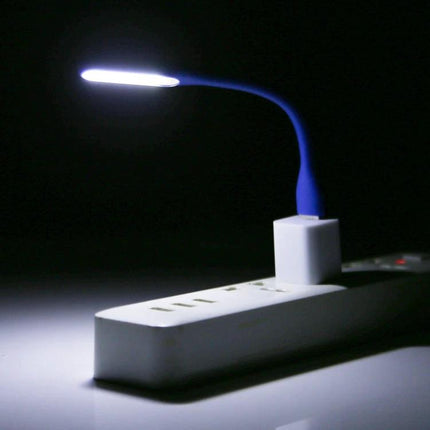 Flexible USB Light for Reading at Home or While Traveling - compact blue gooseneck lamp plugged into USB power strip for focused reading light