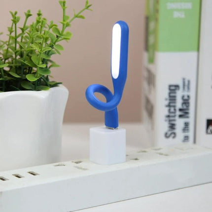 Flexible USB Light for Reading at Home or While Traveling - blue flexible USB reading light plugged into USB adapter