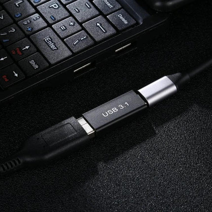 Aluminum Alloy Type-C to USB 3.0 Female Adapter for Connectivity — close-up of aluminum adapter plugged into laptop enabling USB 3.0 data transfer