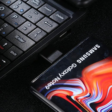 Durable Aluminum Alloy USB-C to USB 3.0 Male Adapter connecting a USB-C Samsung Galaxy device to a laptop USB 3.0 port for data transfer